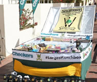 The Checkers supermarket chain partnered with Stellenbosch University's Wilgenhof Mens' Residence to break the Guinness World Records world record for the world's largest lunchbox. The lunchbox measuring 8,47m3 (2,55m x 2,66m x 1,25m) shattered the previous world record of 4,74m3. 