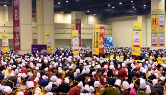 With winter solstice, one of 24 Chinese traditional astronomical markers, around the corner, nearly 7000 people have begun making dumplings together at Zhengzhou's International Exhibition Center, hoping to set a new World Record for the largest cooking lesson in Henan's capital, Zhengzhou. Families, including adults and their children, ranging in age from 4 to 70 years old, take part in the event.