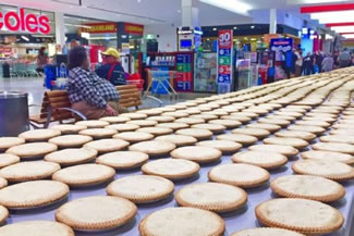 1,608 apple and apricot pies were lined up and the record attempt checked by an official.