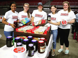 The school has set the world record for the most peanut butter and jelly sandwiches made in one hour, as hundreds of volunteers put together 49,100 sandwiches at the Liacouras Center. 