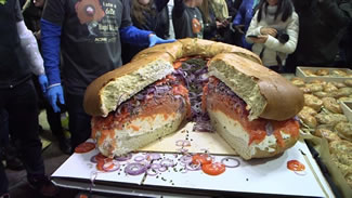 Brooklyn's own Acme Smoked Fish attempted the world record for the largest bagel and lox sandwich. They crafted the 213-pound 75-ounce sandwich in honor of National Bagel and Lox Day (February 9). The smoked fish wholesaler partnered with Zucker's Bagels outside of Acme's 30 Gem St. location in Greenpoint to assemblethe world's largest favorite Jewish breakfast item. 
