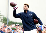  New York Giants' Odell Beckham Jr. catches a pass from New Orleans Saints' Drew Brees, while setting the World Record for the most one-handed catches in one minute with 33 on Thursday, Jan. 29, 2015 in Scottsdale, Ariz.