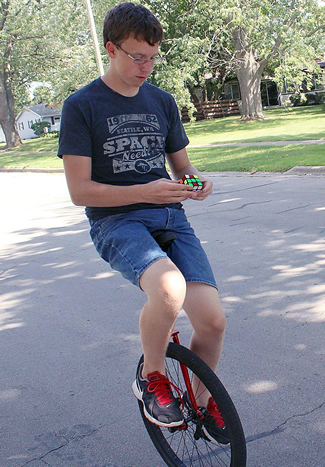 14-year-old Stuart Sobeske broke the world record for most Rubik's Cubes solved while riding a unicycle. The previous Guinness World Records record was 28 cubes solved, held by Adrian Leonard of Belfast, Ireland. Stuart completed 80 cubes before they ran out, taking him about an hour.