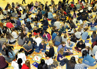 585 students and staff gathered for the occasion and played 84 separate games of Monopoly to break the world record previously held by NC State University Housing (USA).