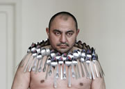 most spoons balanced on a human body Etibar Elchyev