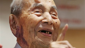 Yasutaro Koide, the 112-year-old living in central Japan's Nagoya, smiles upon being formally recognized as the world's oldest man at a nursing home in Nagoya. Koide was born on March 13, 1903. 