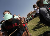 most people wearing a frog mask Texas Tech students