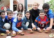 MK Tzipi Livni and a group of children at the world record dreidel challenge in Tel Aviv. Some 754 adults and children successfully spun dreidels for 10 seconds in a row at the city's Sarona shopping compound. The previous Guinness World records' record was for 377 dreidels.