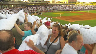 The St. Paul Saints have set a new Guinness World Record for the largest pillow fight; 6,261 fans joined in the fluffy fun.