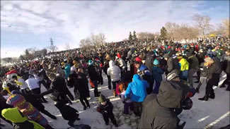 Organizers estimated that more than 8,200 people came to claim the world's largest snowball fight title.