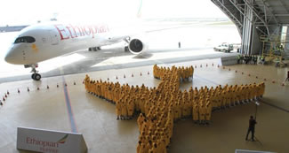  Ethiopian Airlines has broken a Guinness World Record for making the largest ever human image of an Airplane. The event was part of Africa's first Airbus A350 XWB delivery and 350 Ethiopian Employees have gathered at Ethiopian Maintenance hangar to create an image of the actual A350 aircraft.