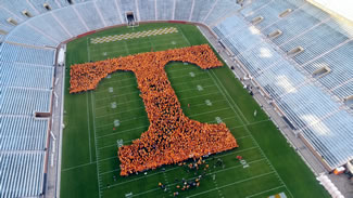 University Of Tennessee Sets World Record For Largest Human Letter. A total of 4,223 students, alumni and faculty formed a giant "T" on the school's Shield-Watkins Field. Volunteers stood together to create a Power T that spanned 190 feet by 190 feet, encompassing the majority of Shields-Watkins Field at Neyland Stadium.