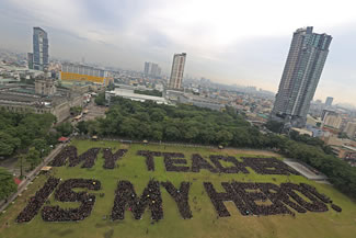  A total of 17,011 students of University of Santo Tomas (UST) formed the sentence "My teacher is my hero" to commemorate their teachers during the National Teachers' Month on the UST Open Field, thus setting the new world record for the Largest human sentence, according to the World Record Academy.