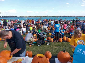  Citizens from across metro Detroit gathered in Nautical Mile Park on Water Street for a Pumpkin Palooza Party hosted by the Mariner Theatre, the Marine City Area Chamber of Commerce and Vandenbossche Farms.The group carved 1,064 pumpkins, topping the previous record by four.