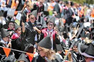 West Byford Primary School smashed the Guinness world record for the most people dressed as the popular book character in one place, with 997 students, staff and parents filing on to the school oval while clutching their wands.