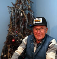  Neil Olson of Wausau sits in front of the Christmas tree that has stood in his house since Christmas of 1974. Photo taken, Friday, October 17, 2014. 