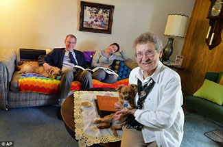 Modern family: Bernice Dyck (right) adopted Chenda Kaub Chumb (center) in June last year. Also pictured is Bernice's son, Rick (left). 