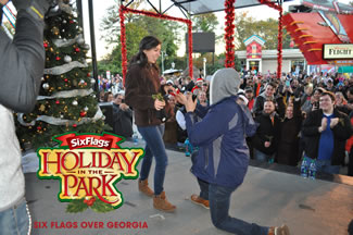 839 couples joined hands and kissed for at least 10 seconds under romantic sprigs of live mistletoe provided by Mistletoeing.com to break the previous Guinness world record, set by Six Flags Over Georgia in 2015.