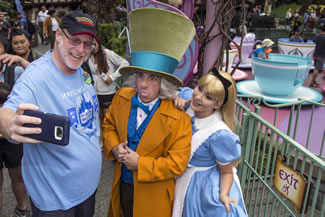  Huntington Beach resident Jeff Reitz, who has visited the parks of the Disneyland Resort every day since January 1, 2012, marked his 2,000th consecutive visit on June 22. Here, Reitz snaps a selfie with The Mad Hatter and Alice after a teacup ride at the Mad Tea Party in Fantasyland at Disneyland during his 2,000th visit to the park.