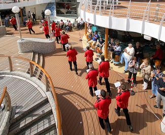 Musicians from the British Imperial Military Band completed multiple laps of a specially-measured circuit of the giant cruise ship's pool deck, completing the one-mile march in an impressive 14 minutes 26 seconds. 