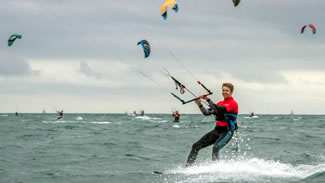  Virgin Kitesurfing Armada UK's attempt off Hayling Island, Hampshire, involved 423 participants parading over a one-mile (1.6 km) course.