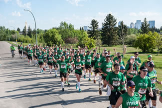 A total of 112 linked runners crossed the finish line together at the Calgary Marathon, breaking the Guinness World Record for the 
