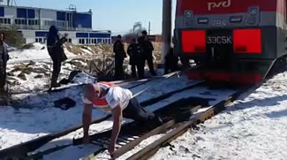 One of the world's strongest "human tow trucks," Vladivostok resident Ivan Savkin managed to pull a 288-ton electric train a total distance of 1.1 metres in Primorsky Krai's village of Smolyaninovo, thus setting the new world record for the Heaviest train pulled.
