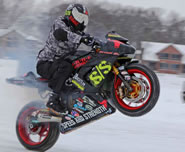 Ryan Suchanek, a motorcycle stunt rider from Milton, reclaimed the World Record in the category he invented by hitting 117.5 miles per hour on one wheel before an enthusiastic crowd of about 500 people lining the icy drag strip on the north side of Lake Koshkonong. 