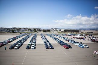 Toyota owners, a total of 332 made a parade lap to celebrate the Earth Day on April 22, 2016. The Toyota Prius is a full hybrid electric mid-size hatchback car and is considered to be the cleanest vehicles sold in the United States.