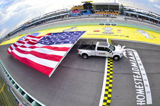 All-new 2017 Ford F-450 Super Duty sets a new world record for the World's Largest Flag Pulled by a Moving Vehicle, pulling a 45 by 92 foot, 4,124 U.S. flag over four laps at Homestead-Miami Speedway's 1.5 mile track. 