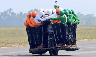   Bengaluru, INDIA -- A group of 58 men of the Indian Army Service Corps (ASC), 'Tornadoes', mounted on a single 500 cc Royal Enfield motorcycle and rode it for a distance of 1200 meters as part of a display at the Air Force Station Yelahanka in Yelahanka, Bengaluru, thus setting the new world record for the Most people on one motorcycle, according to the World Record Academy.